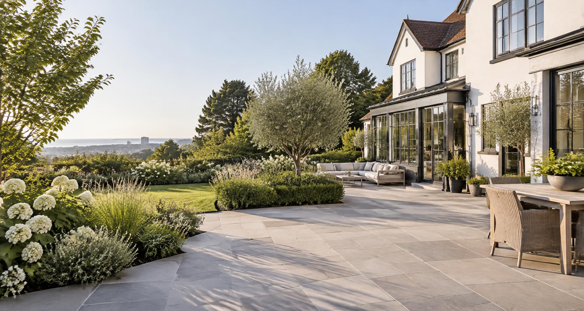 Illustrative landscaped Sussex garden with natural stone paving